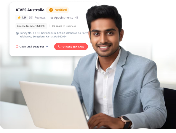 Man using laptop with AIVES Australia verified immigration consultant profile on Find & Consult.